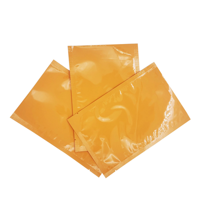 Buy Aluminium Foil Laminated Glossy Orange Color Custom Flat Pouches for Face Mask Sheet, Facial Cream Packaging online manufacture