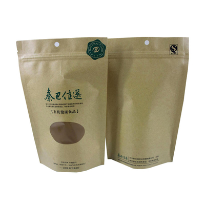 Buy Printed Eco Friendly Resealable Stand Up Kraft Paper Pouch Bags With Custom Round Window For Tea Leaves Beans Packaging online manufacture